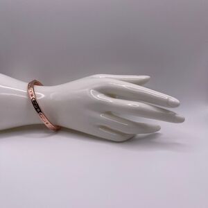 COACH Women's Rose Gold Kissing C Logo Signature Hinged Crystal Bangle Bracelet